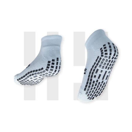 Pair of white ankle socks by Grip Star Socks.